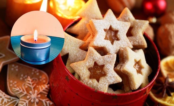 una scatola di biscotti e una candela vicino